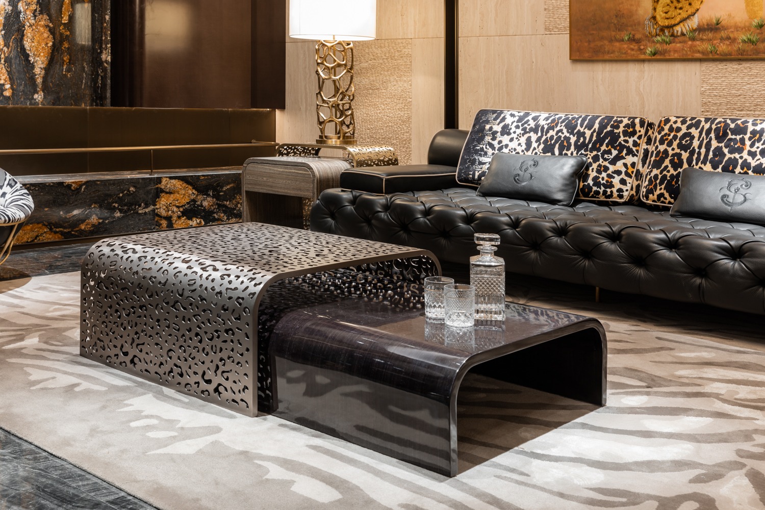 Sculptural dark metal coffee table with perforated pattern