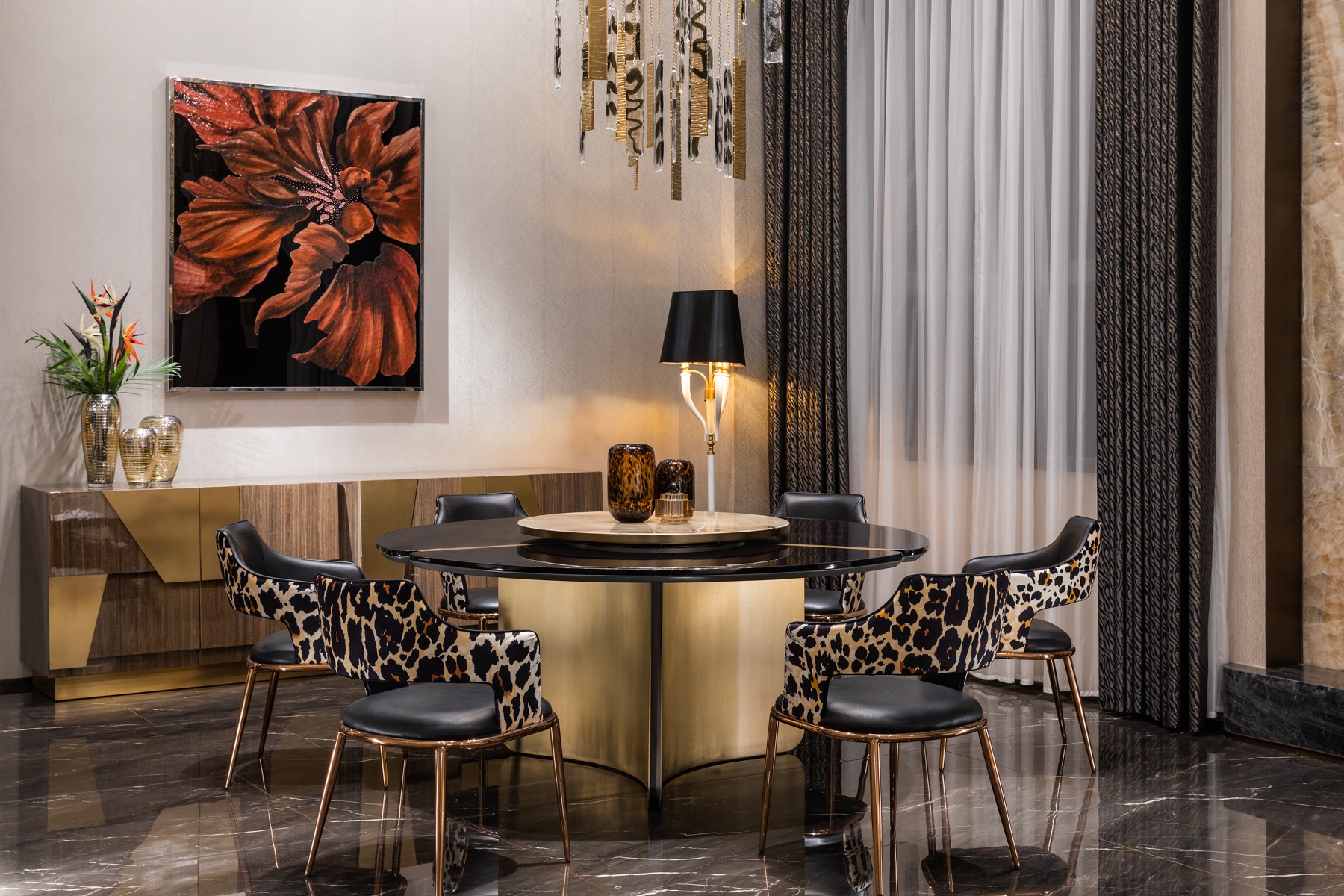 Round black and gold dining table with patterned contemporary dining chairs